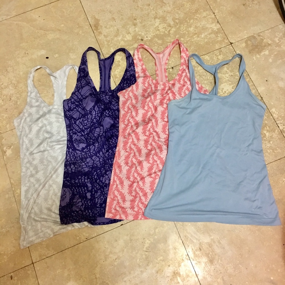 Bundle of 4 Nike Size Small Tanks